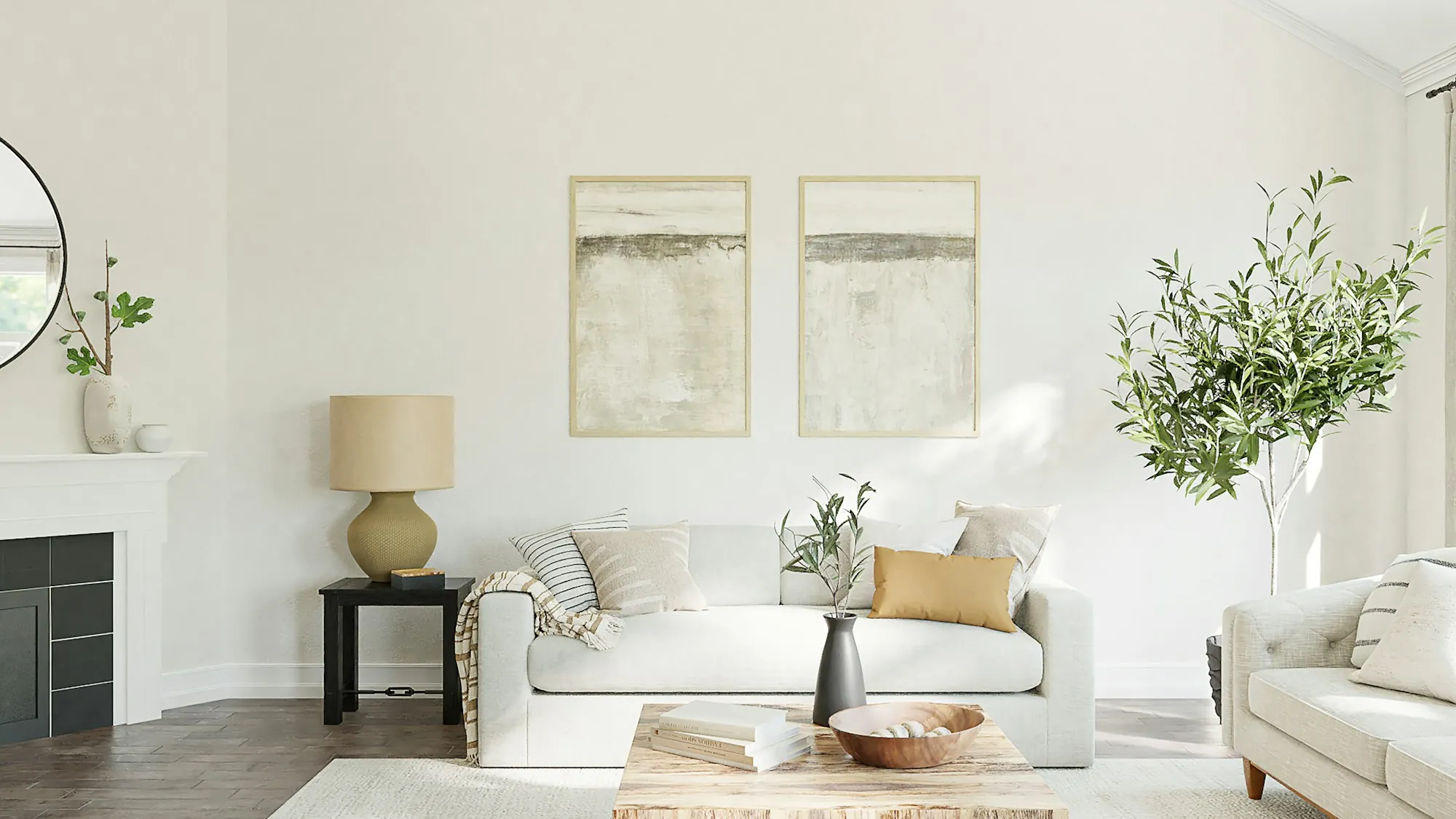 Living room with a fireplace, a white sofa and framed art on the wall