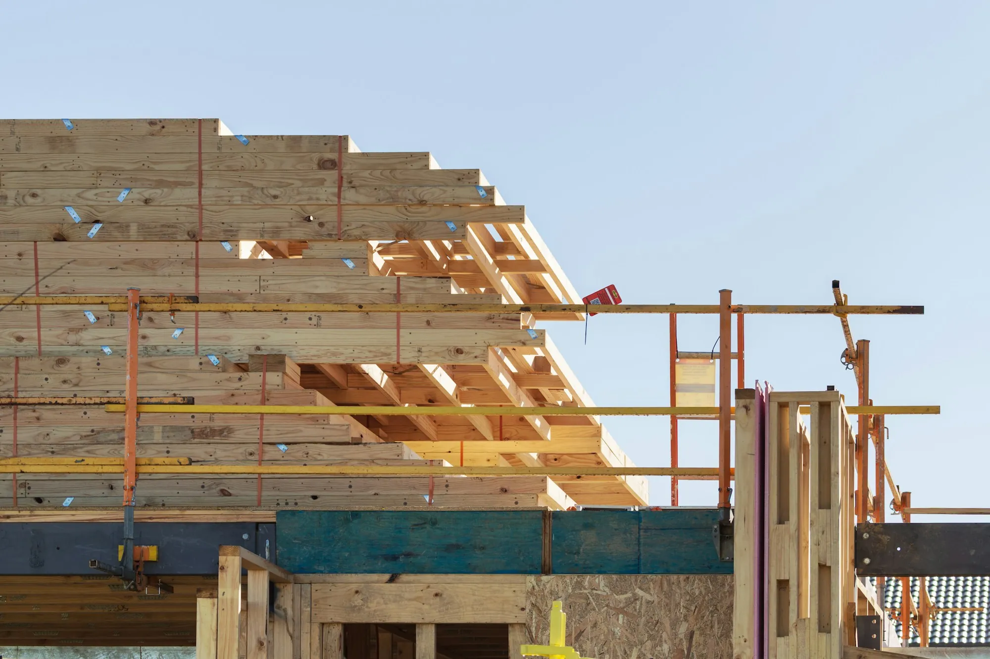 Roof framing and scaffolding on a house under construction