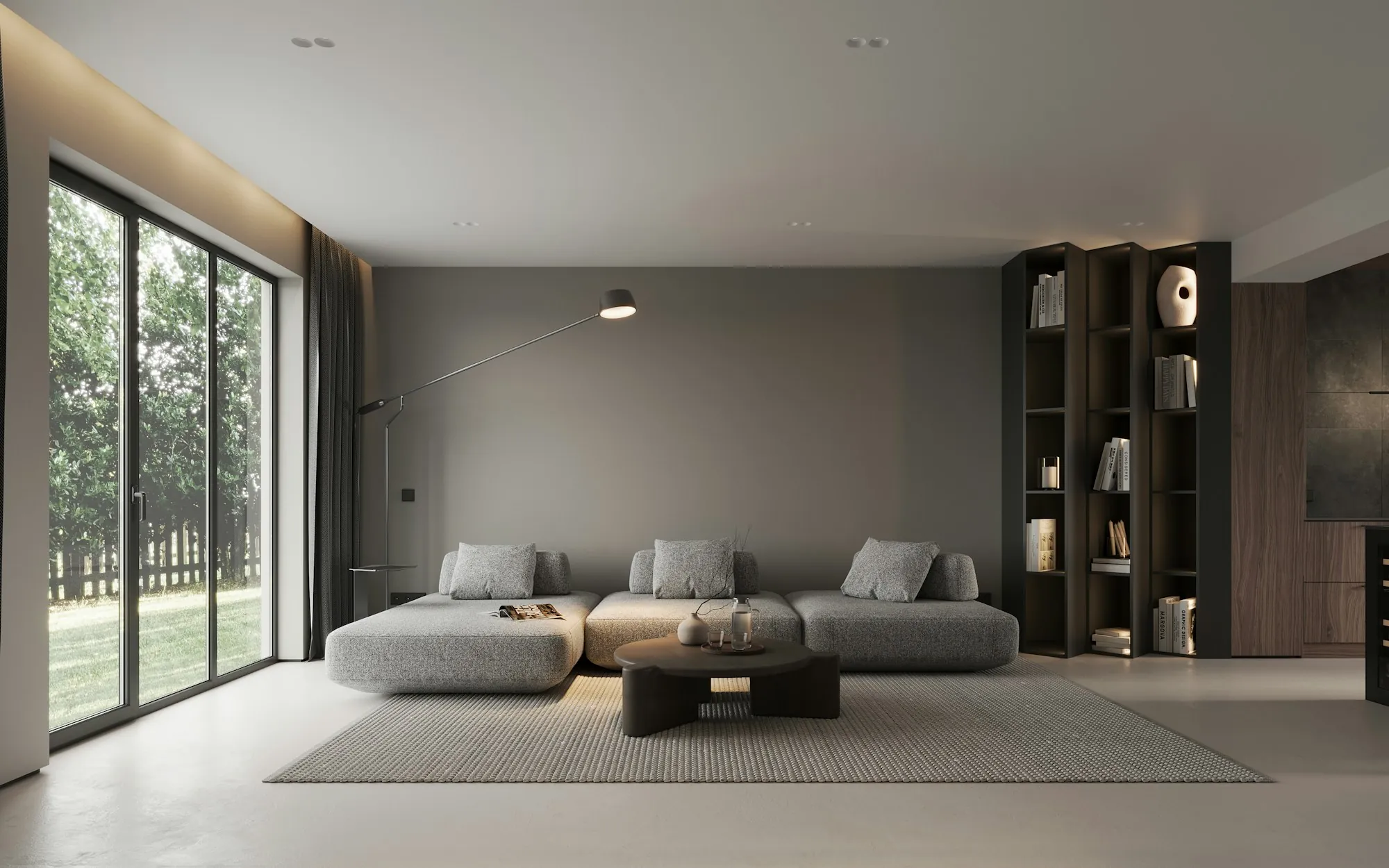 Minimal living room with a gray sectional, built-in shelves and sliding glass doors